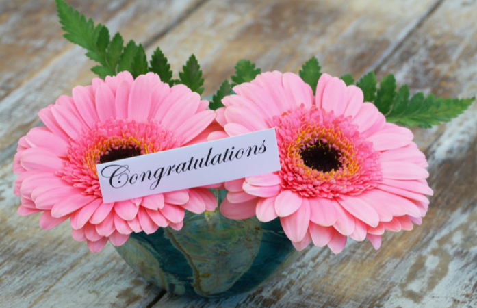  pink flowers with congratulations in them
